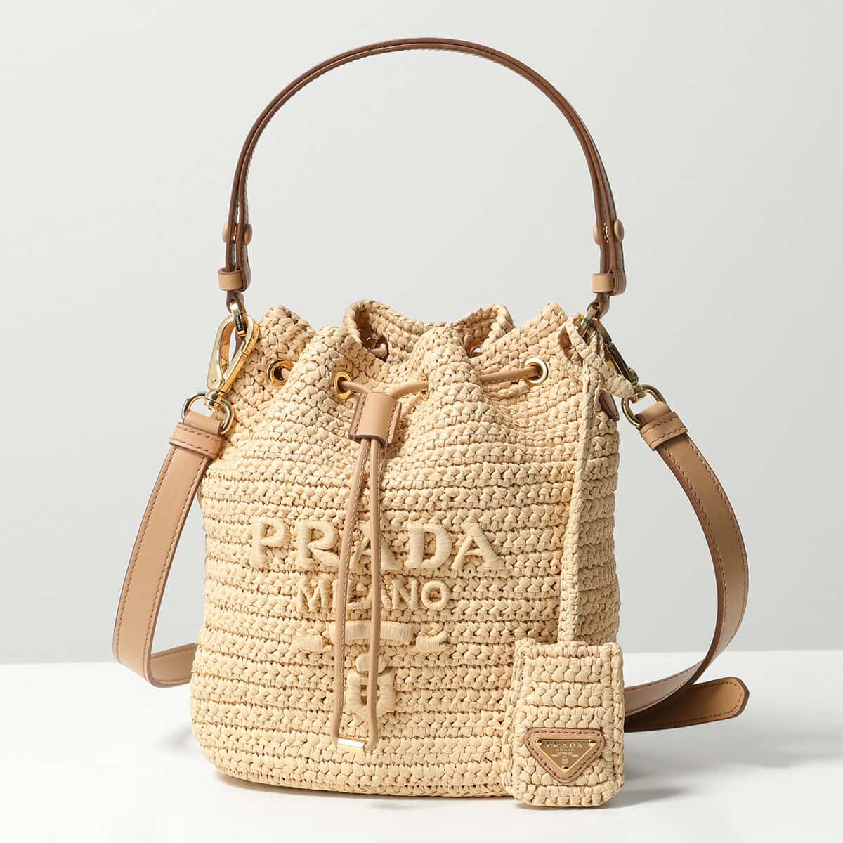 PRADA プラダ バケットバッグ 1BE068 2A2T OUO レディース ラフィア かごバッグ ハンドバッグ ショルダーバッグ ロゴ 鞄 F0018/NATURALE